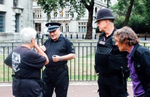 2 Angie talking to police with Bernard looking on